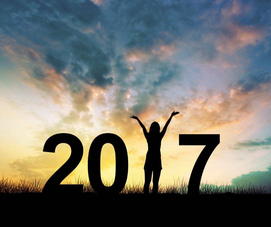 Silhouette young woman Enjoying on the hill and 2017 years while celebrating new year